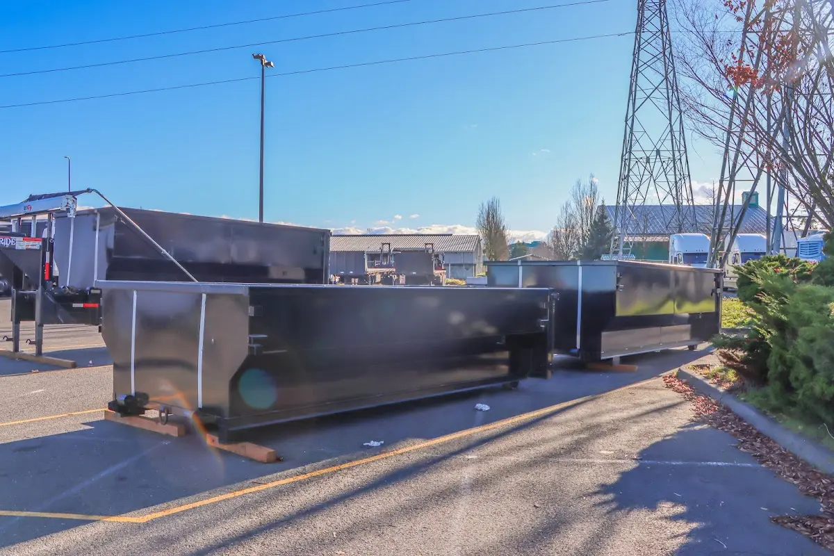 Roll-off dumpster ready for waste disposal at job site for Demolition Dumpster Rental in Manchester